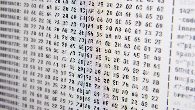 Close up on computer screen binary code on White background.