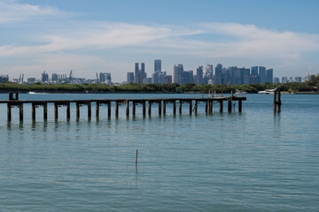 Fototapeta premium Singapore skyline seen from St. John's Island, and offshore island south of Singapore