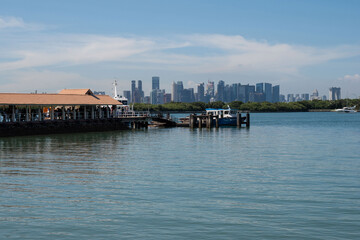 Fototapeta premium Singapore skyline seen from St. John's Island, and offshore island south of Singapore