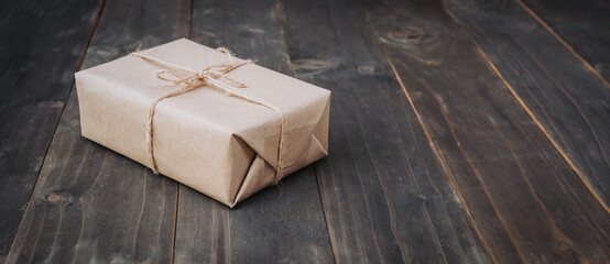  brown gift box on wooden table background with copy space.