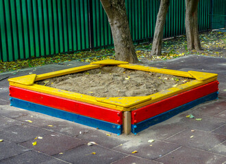 Bright multi-colored children's sandbox on the Playground.
