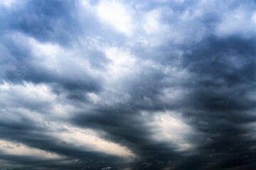 Dark clouds in the evening over the surface of the lake.