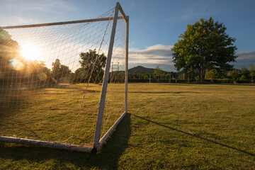 soccer goal with sun beam in the morning light