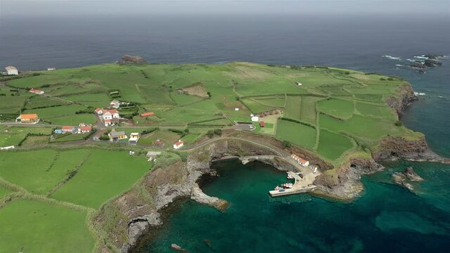 Drone landscape view of green fields and atlantic blue ocean. Flores Island mountains and hills. Azores, Portugal