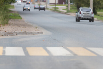 pedestrian crossing in street - white and yellow colors. side view