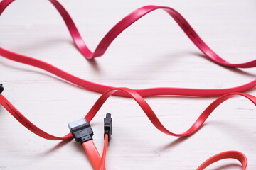 red computer wires for hard drive on light background