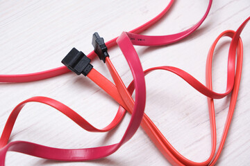 red computer wires for hard drive on light background