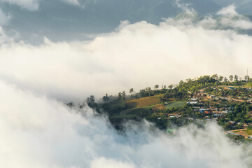 beautiful view sunrise of village on mountain with morning mist in Thailand, travel, landscape and nature concept