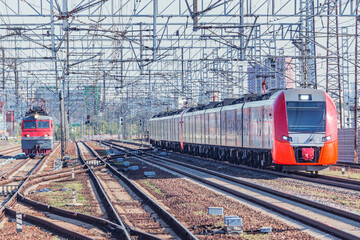Fototapeta na wymiar Highspeed train and locomotive on the station.