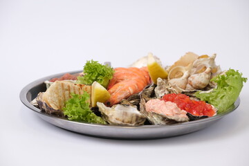 a plate of assorted seafood on a white background