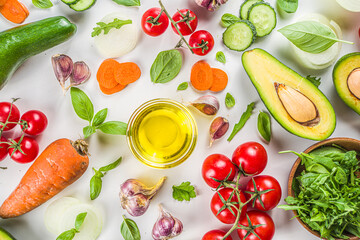 Organic fresh raw vegetables flatlay. Healthy food cooking background with various vegetable salad ingredients.  Vegetarian fresh raw food concept. Top view, copy space