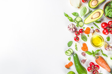 Organic fresh raw vegetables flatlay. Healthy food cooking background with various vegetable salad ingredients.  Vegetarian fresh raw food concept. Top view, copy space
