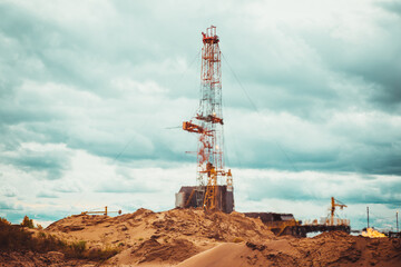 Drilling rig in oil field for drilled into subsurface in order to produced crude. Distortion of air from high temperature