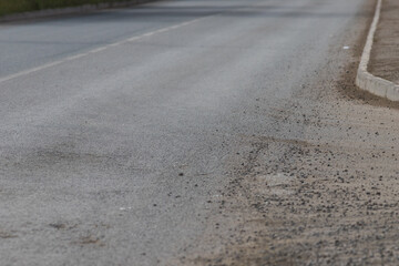 Naklejka premium Light grey asphalt on the new road