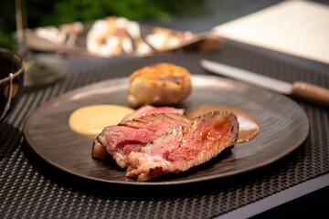 Tender sliced  medium rare beef in fine dine restaurant