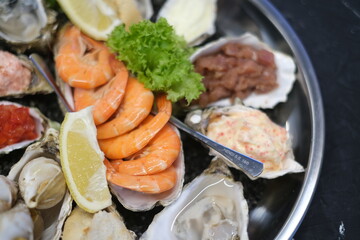a plate of assorted seafood on a white background close-up