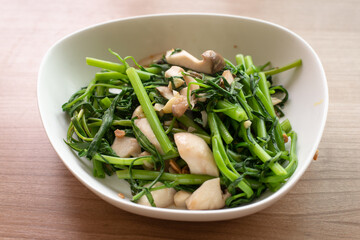 stir fried green morning glory with garlic and mushroom