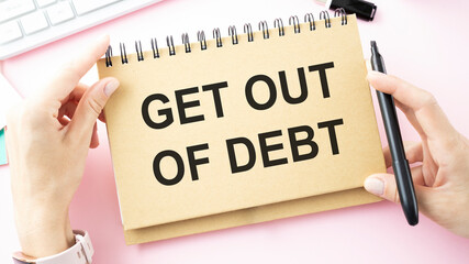 Paper note with text Get Out Of Debt