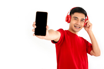 Young man with braces  show mobile phone with blank screen