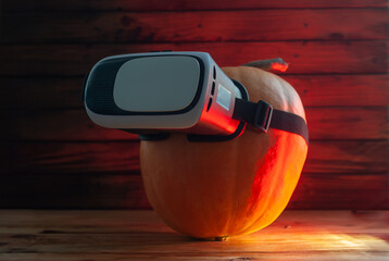 pumpkin and vr glasses, the concept of Halloween future,