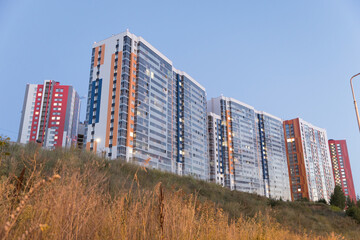 Tall modern residential buildings at sunset