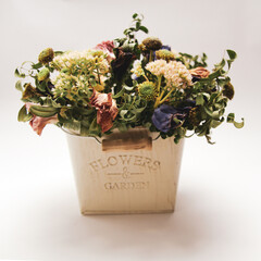 Dried summer flowers bouquet for gift to loved ones. Pot with an inscription "Flowers and garden"