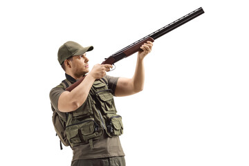 Young hunter aiming with a shotgun