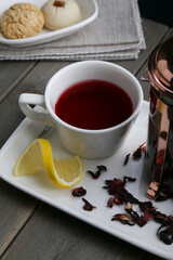 Hibiscus Tea with cookies and lemon slice