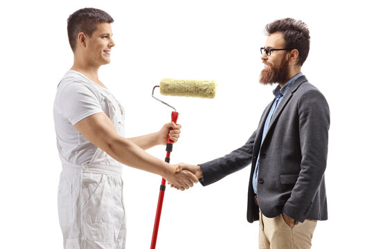 Painter with a roller painter shaking hands with a bearded man