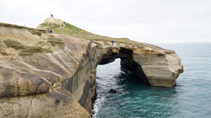 Tunnel Beach Sandstone cliffs at the beach near  Dunedin, New Zealand.
