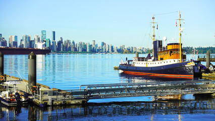 Tugboat at Lonsdale Quay, North Vancouver, BC, with downtown Vancouver waterfront on horizon