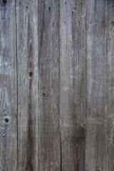 old wooden fence made of boards with peeling paint and scratches, background, grunge