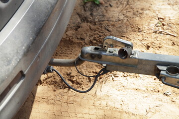 SUV car traction coupling device with trailer lock handle and electrical socket close up, safety...