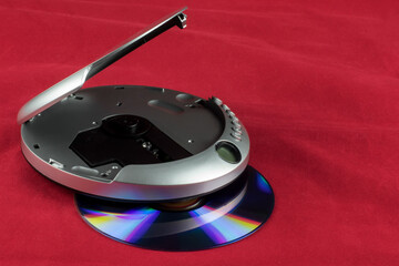 CD Player and CD Isolated on a Red Background