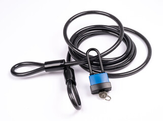 Fototapeta premium bicycle lock with key, cable loops isolated on white