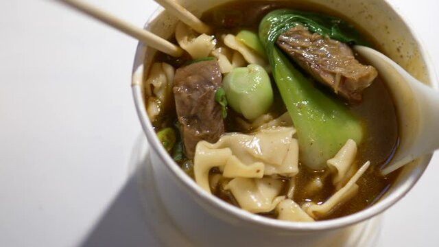 takeout taiwan beef noodle and steam soup pork dumplings