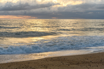 Sandy beach along the Atlantic coast in a summer evening.