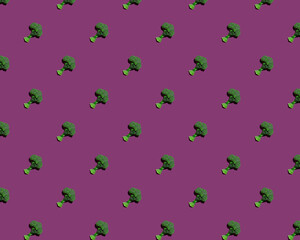 Green broccoli on purple background pattern