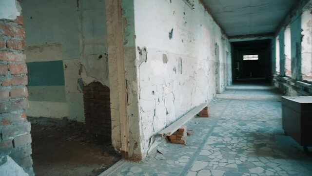Destroyed school in Beslan after the terrorist attack. Old empty school corridors
