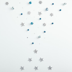 Pine branch, silver snowflake and star over white