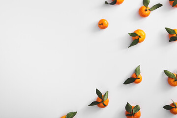 Obraz na płótnie Canvas Ripe tangerines on white background top view