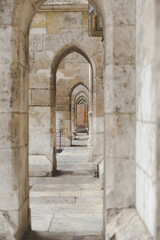 Fototapeta na wymiar stone arches near the entrance to the old church