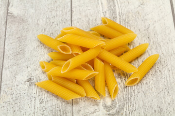 Raw penne pasta for bowl