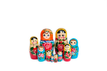 Russian doll. Wooden dolls of different colors on a white background