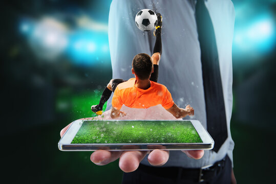 Real soccer player that is displayed on a cellphone