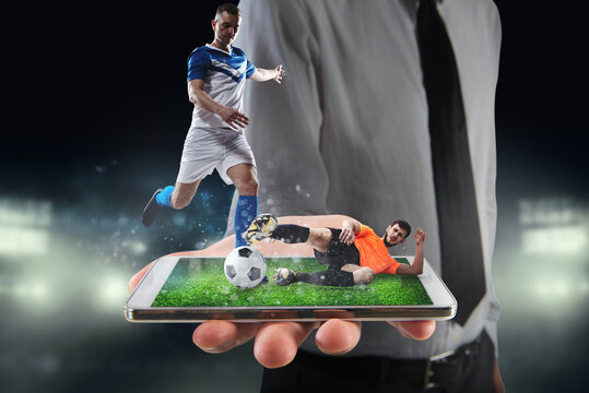 Real soccer players that are displayed on a cellphone during a match