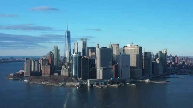 Dolly in aerial on freedom tower downtown skyline