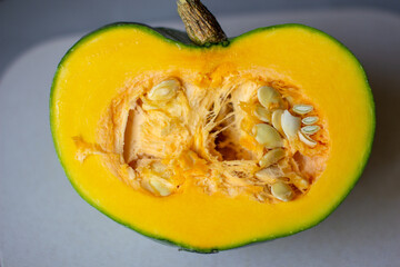 Cut the green pumpkin in the fall. Yellow pumpkin with seeds