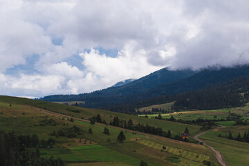 Fototapeta premium scenic clouds in beautiful mountains in summer day
