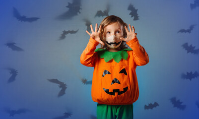 a child in a carnival costume makes a face at the Halloween party